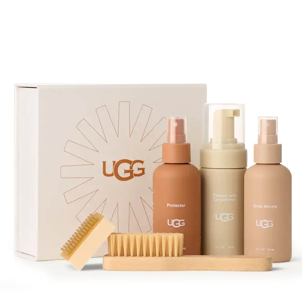 UGG care product set with bottles and a brush on a white background