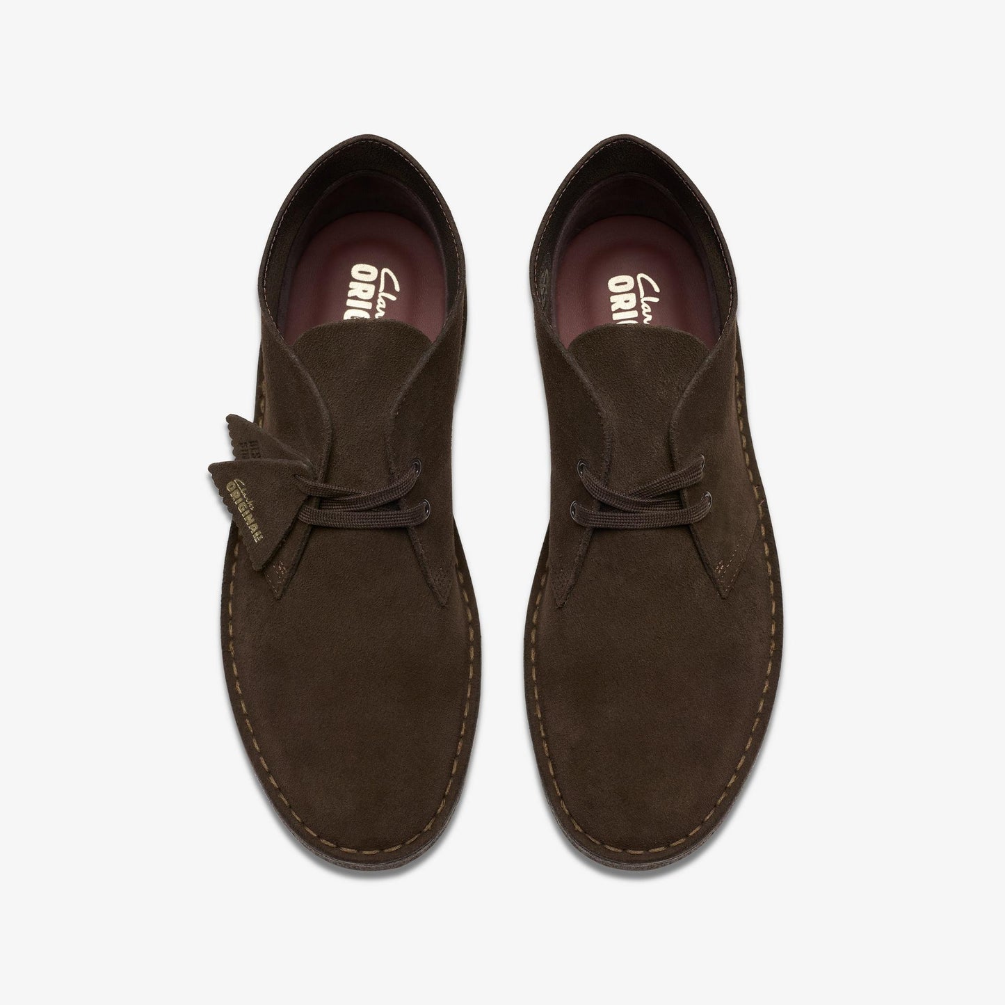 Pair of brown suede shoes on a white background