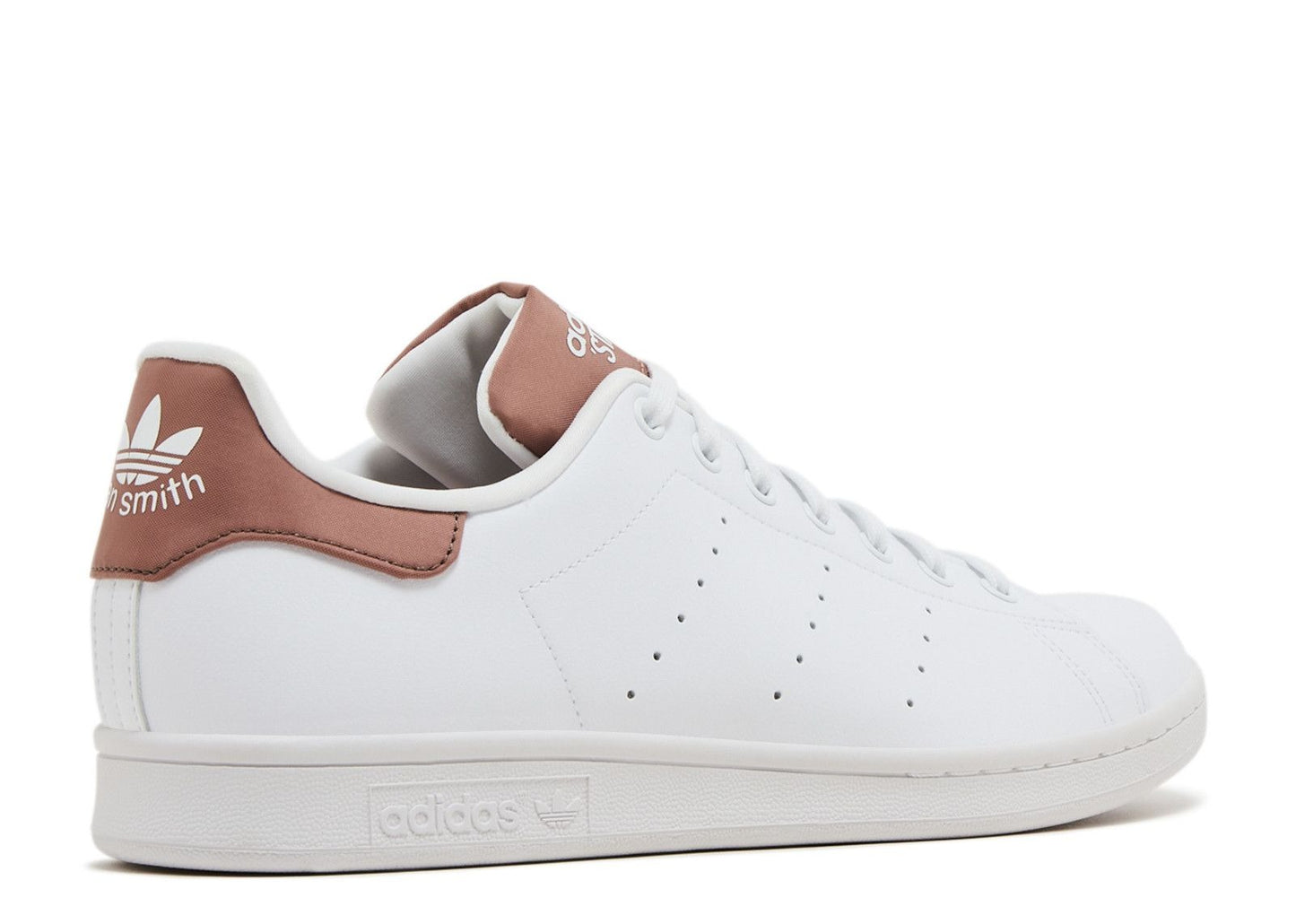 White Adidas sneaker with brown accents on a white background
