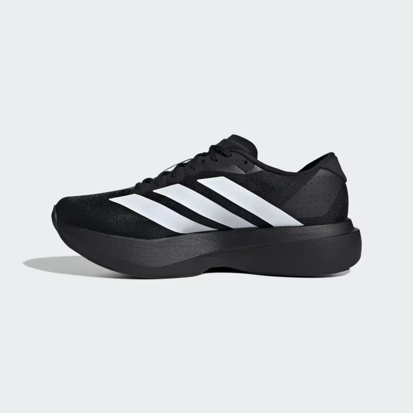 Black Adidas sneaker with white stripes on a light gray background