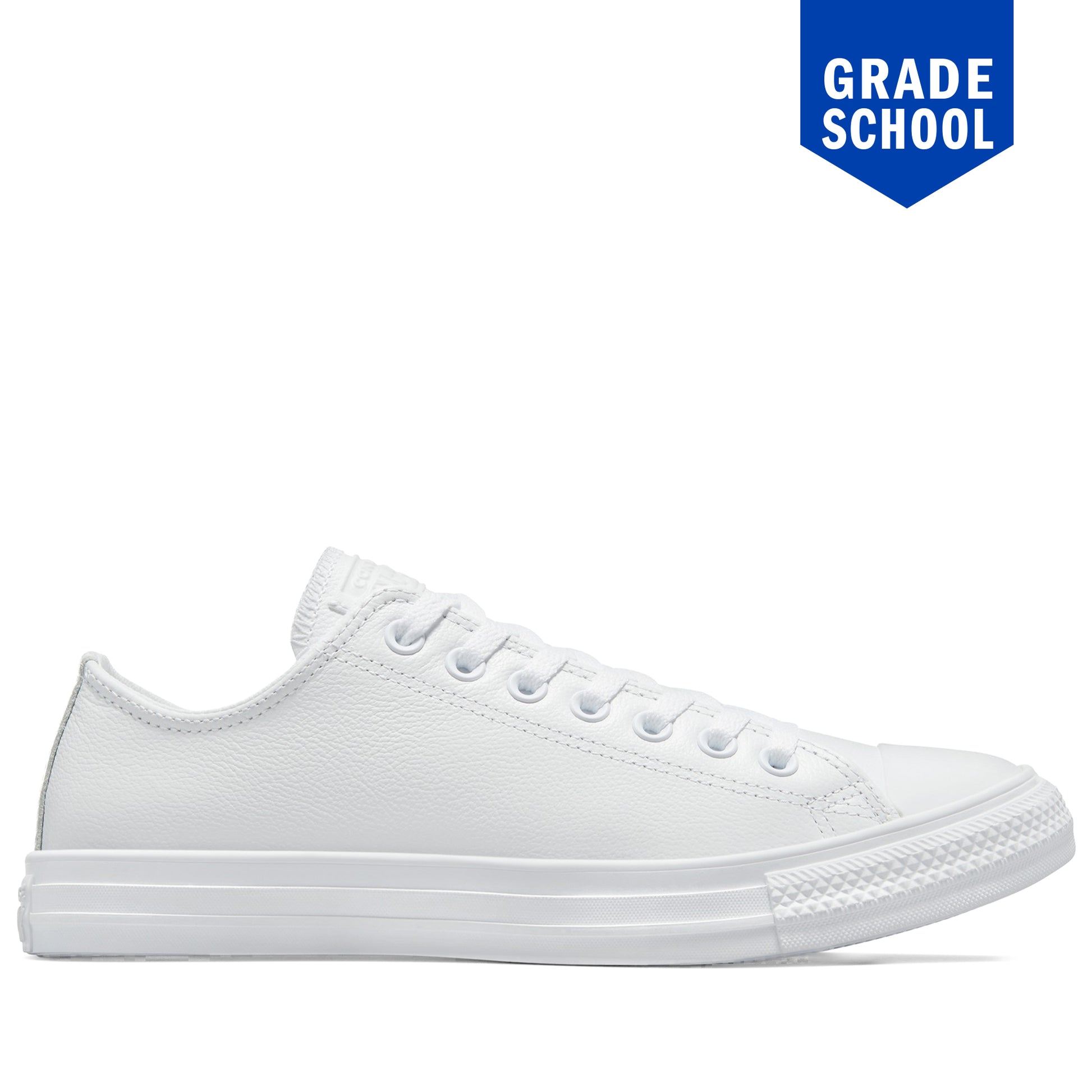 White sneaker on a white background with 'Grade School' label.
