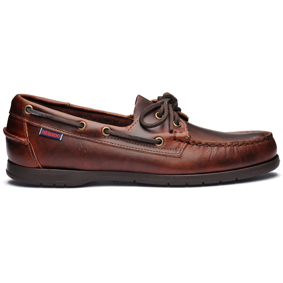 Brown leather boat shoe on a white background