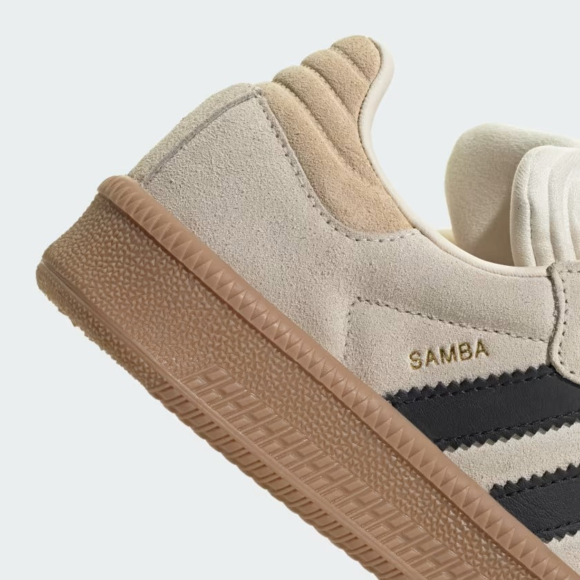 Beige sneaker with brown sole and 'Samba' branding on a light gray background