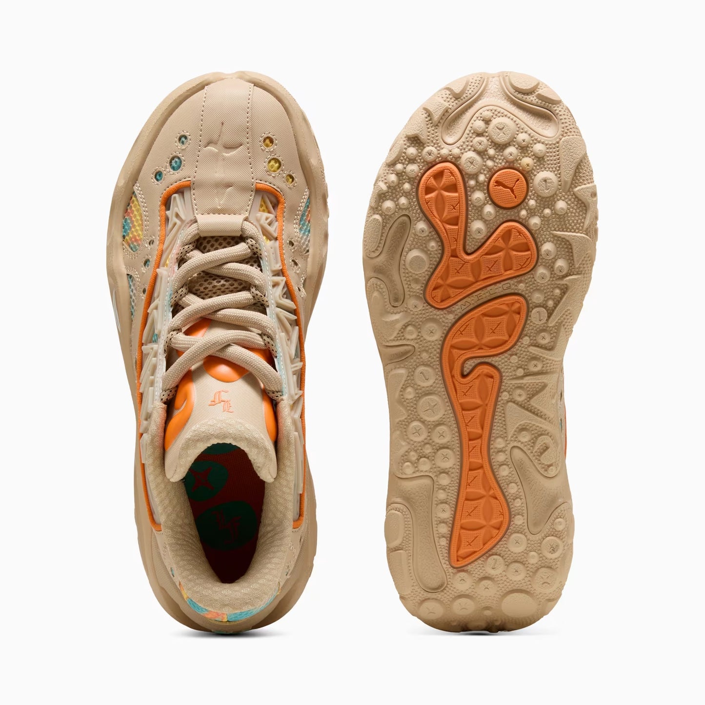 Beige sneaker with orange accents on a white background