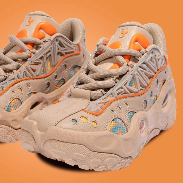 Beige and orange sneakers on an orange background