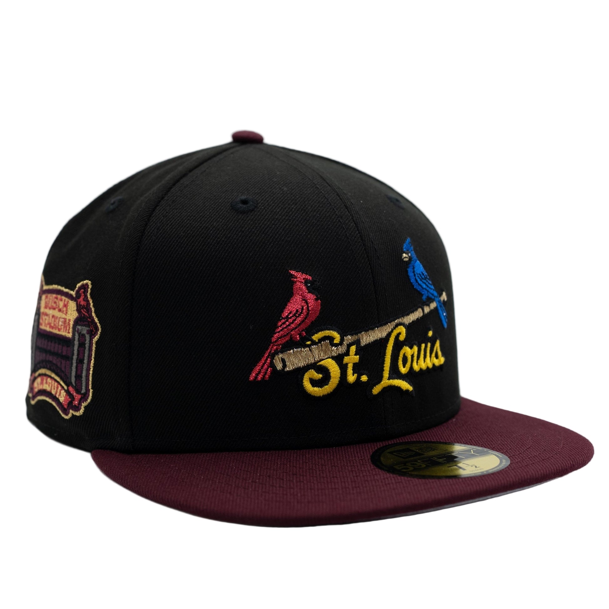 Black and maroon baseball cap with embroidered designs on a white background