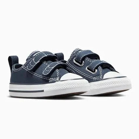 A pair of navy blue toddler sneakers with white rubber soles and hook-and-loop straps, shown against a plain white background.