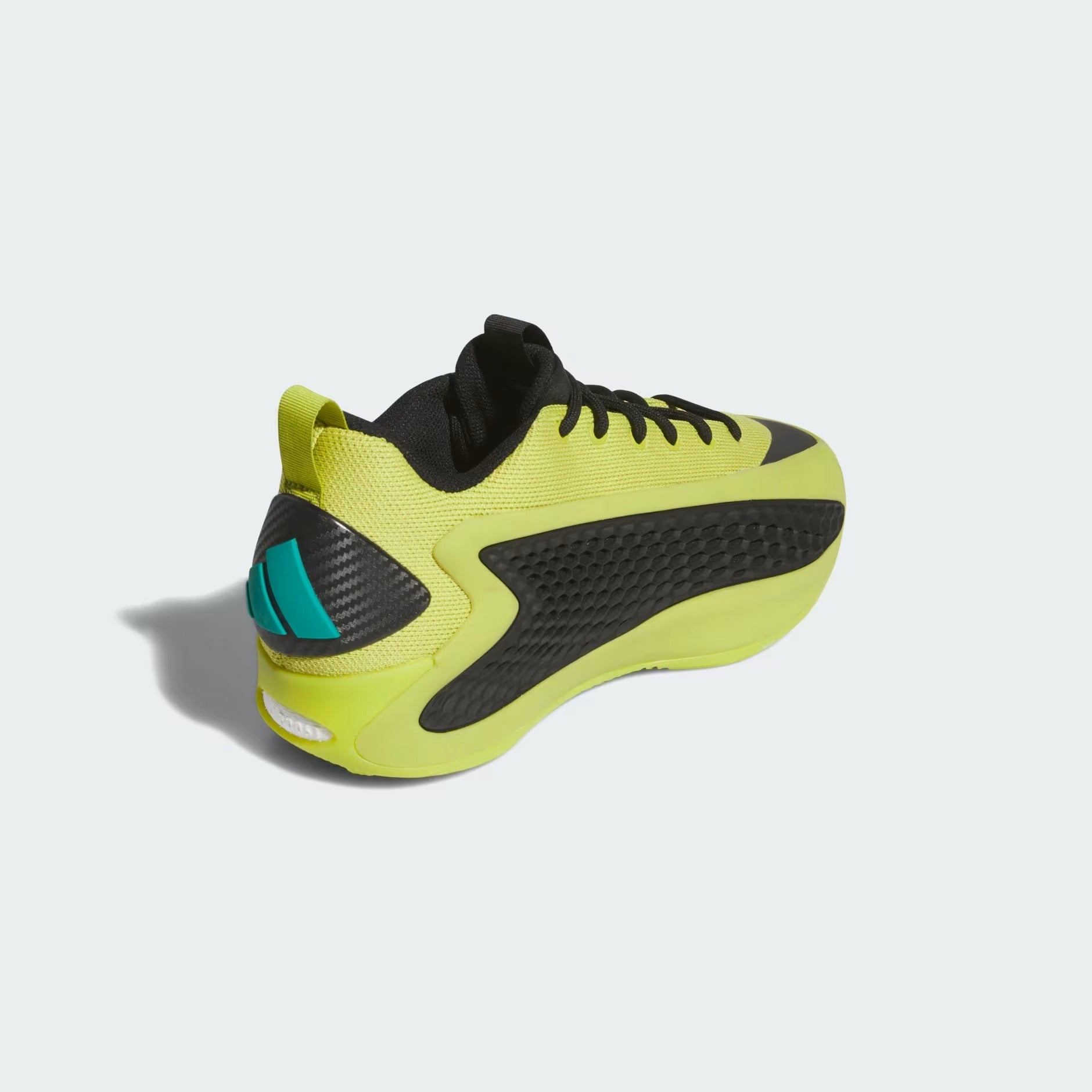 Yellow and black sneaker on a light gray background