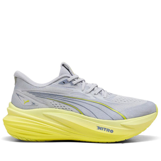 Gray running shoe with yellow sole on a white background