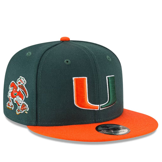 A dark green and orange Miami Hurricanes fitted baseball cap with a large embroidered 'U' logo on the front and a cartoon mascot on the side, shown on a white background.