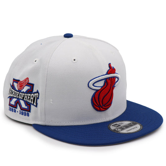 White and blue cap with red and blue logo on a white background