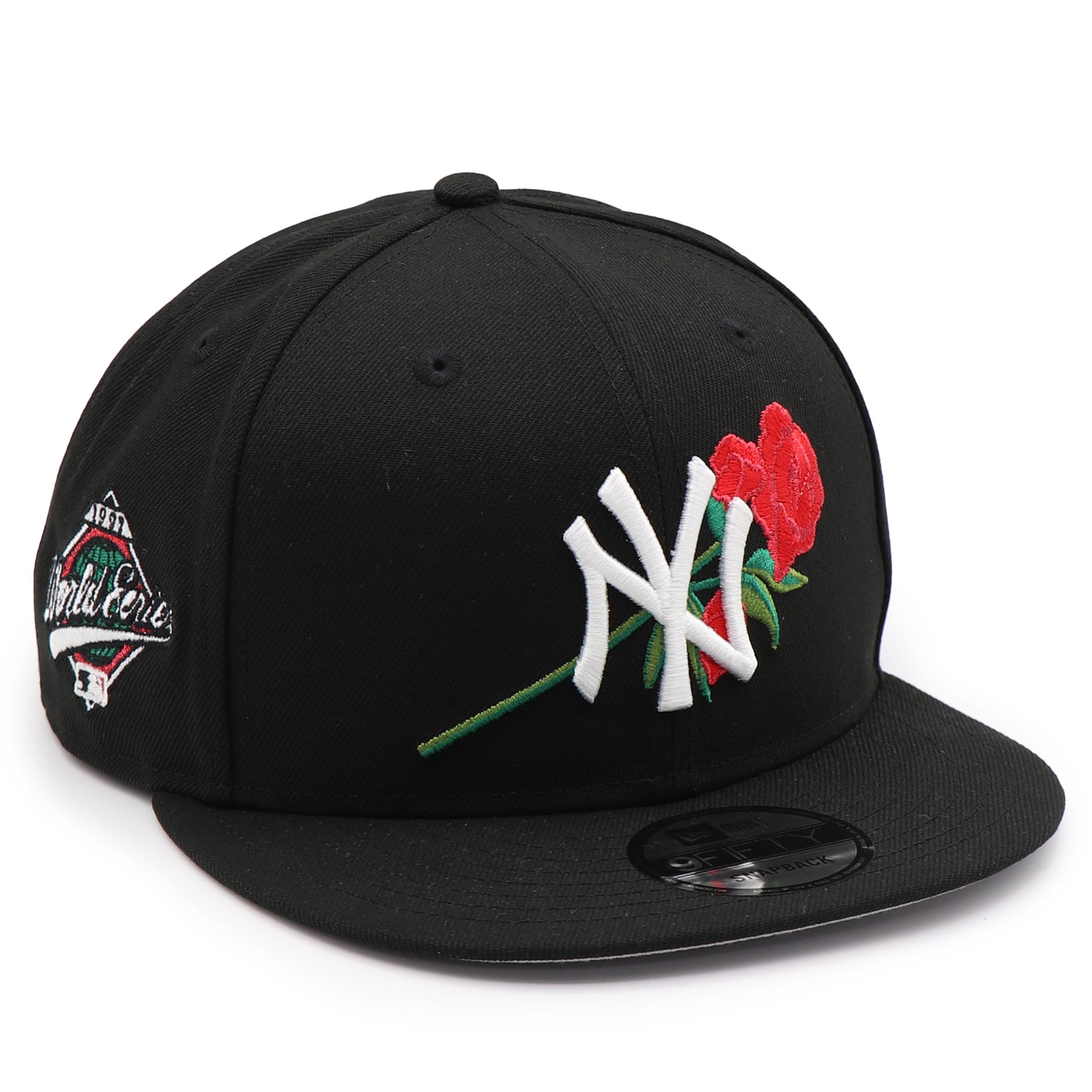 Black cap with a rose and logo design on a white background
