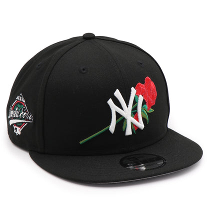 Black cap with a rose and logo design on a white background