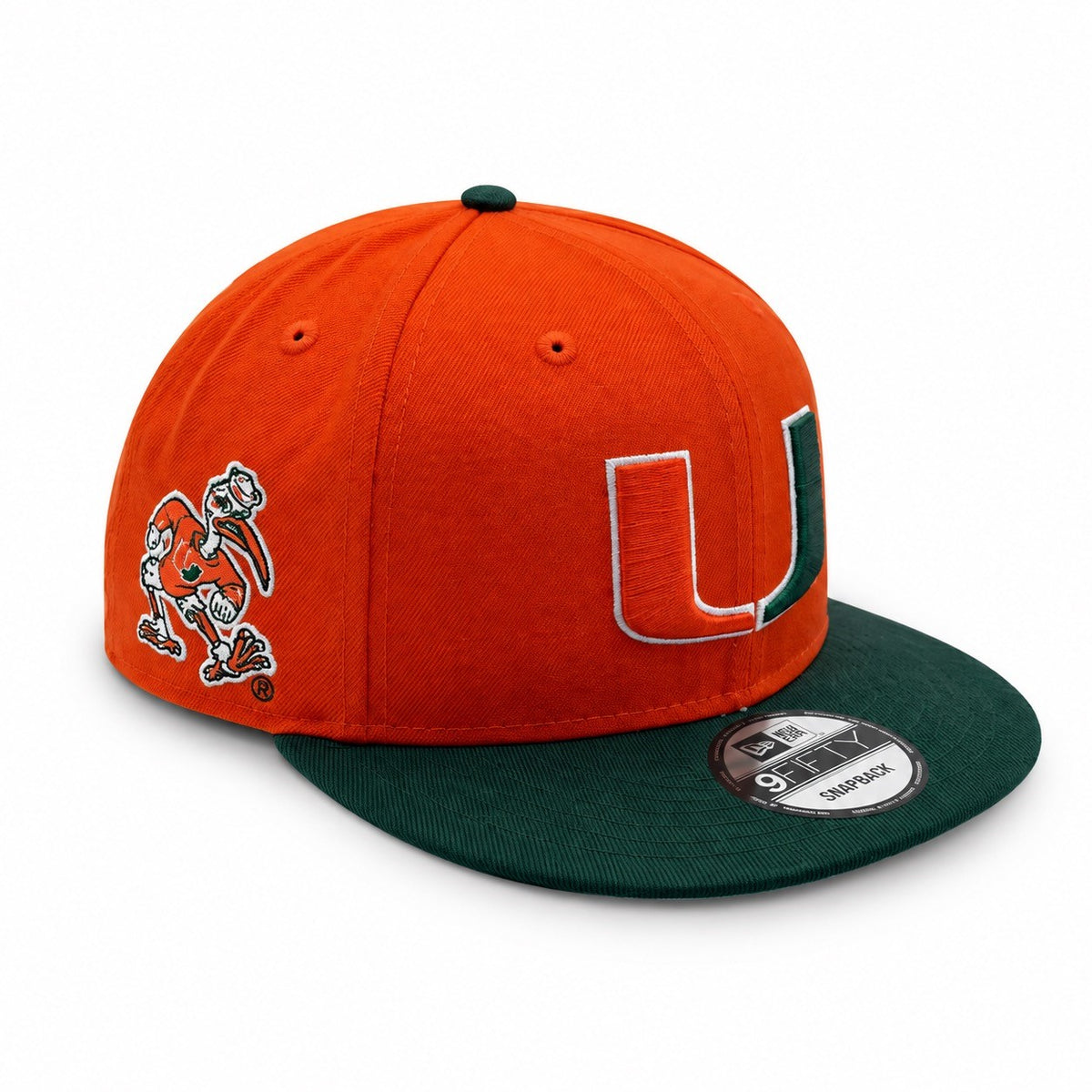 An orange and dark green Miami Hurricanes 9FIFTY snapback cap by New Era, featuring a large embroidered 'U' logo and the Hurricanes mascot on the side, set against a plain white background.
