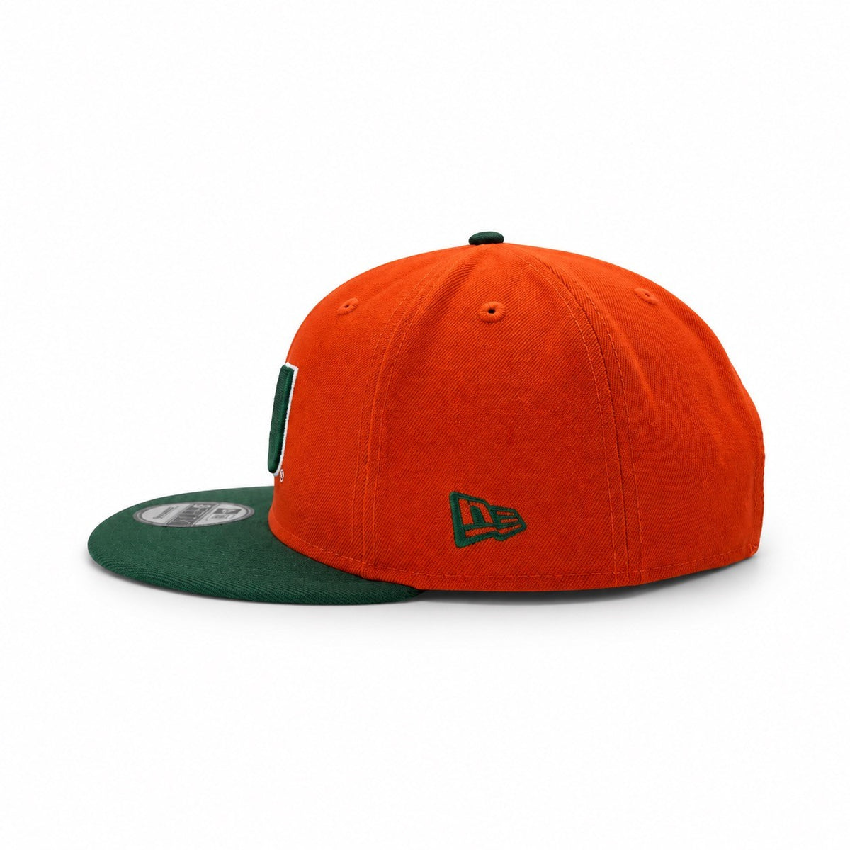 An orange and green New Era 9FIFTY fitted cap on a white background, featuring an orange crown with a green embroidered New Era logo and a green flat brim.