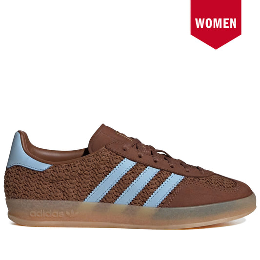 Brown Adidas sneaker with blue stripes on a white background