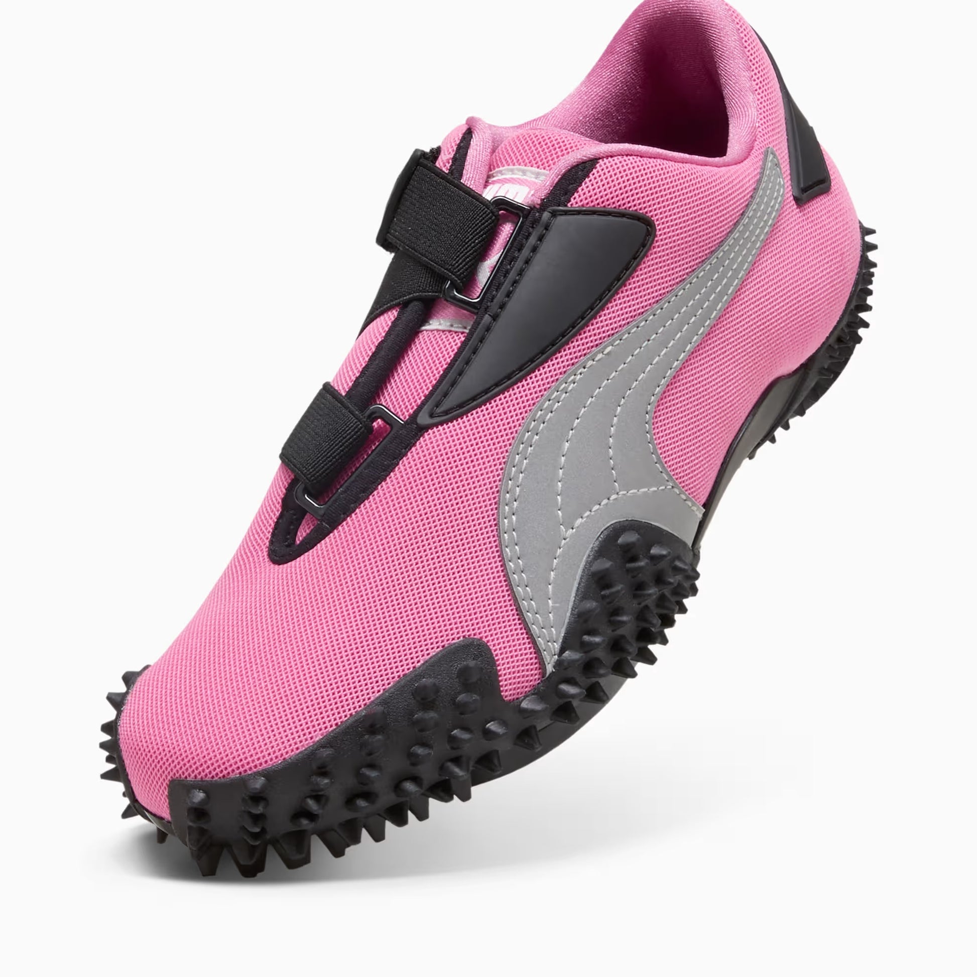 Pink and gray shoe with black sole on a white background