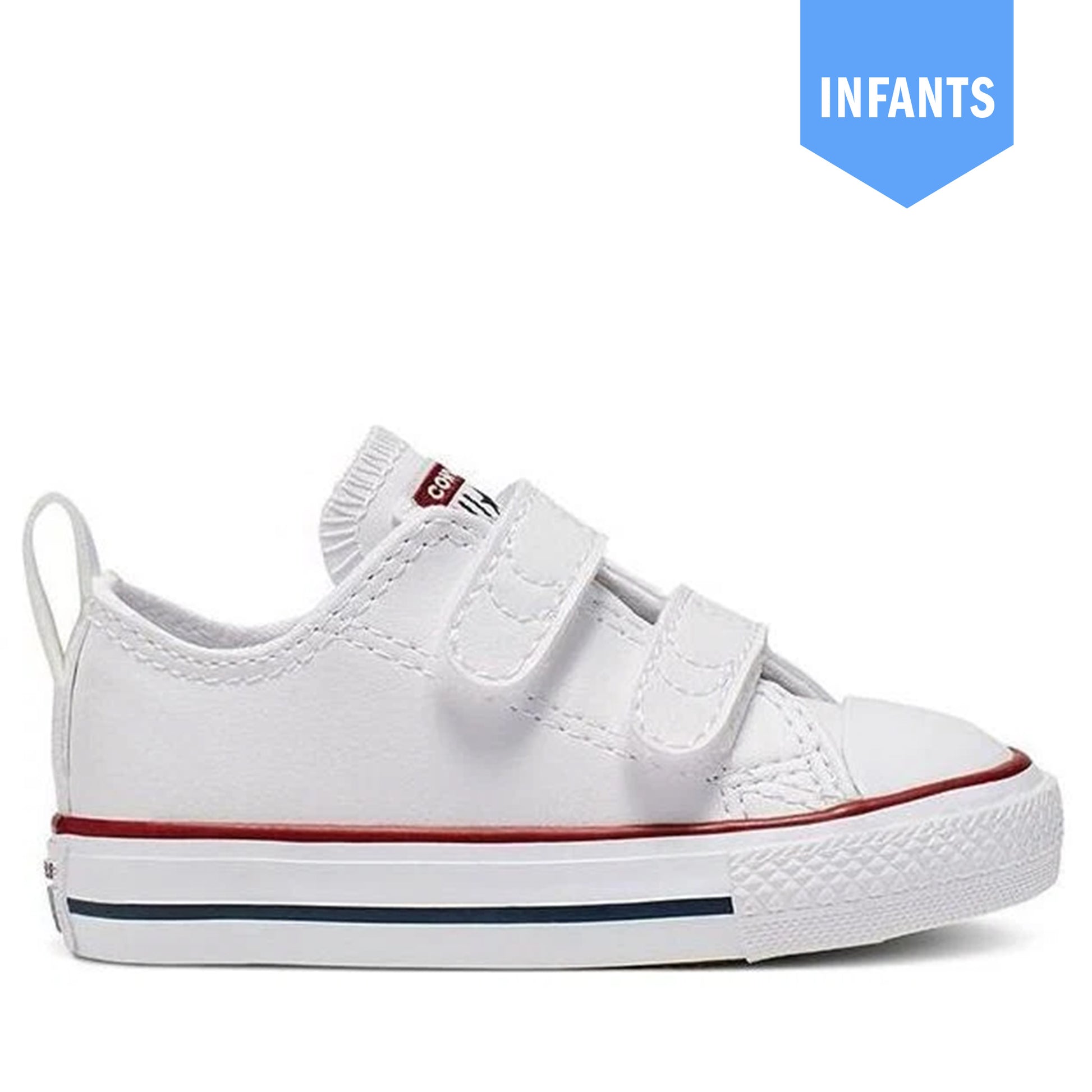 A white toddler low-top sneaker with two hook-and-loop straps, a red stripe along the midsole, and a blue stripe on the outsole, shown against a white background with a blue 'INFANTS' badge in the top right.