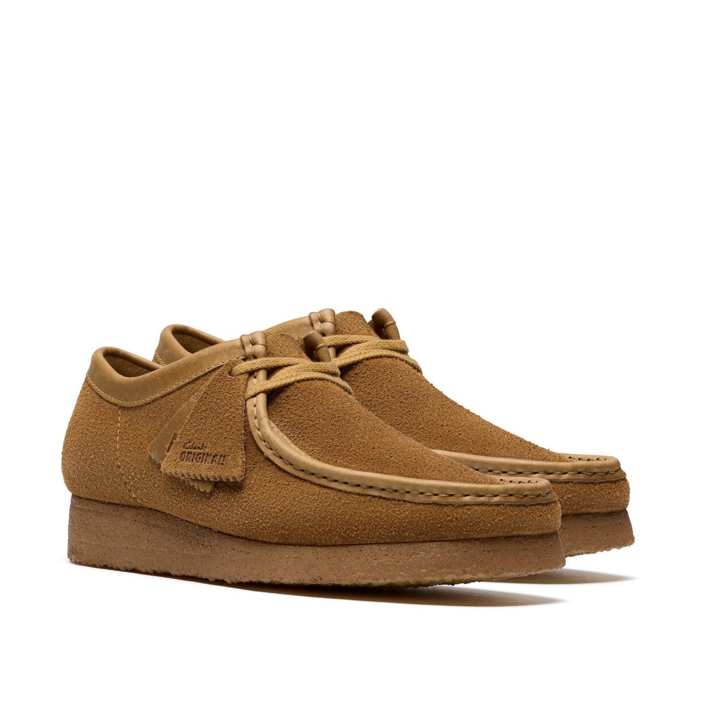 Pair of brown suede shoes on a white background