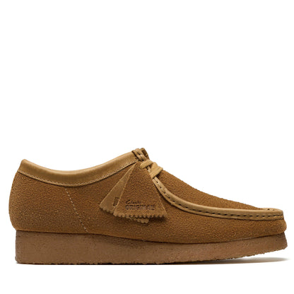 Brown suede shoe on a white background
