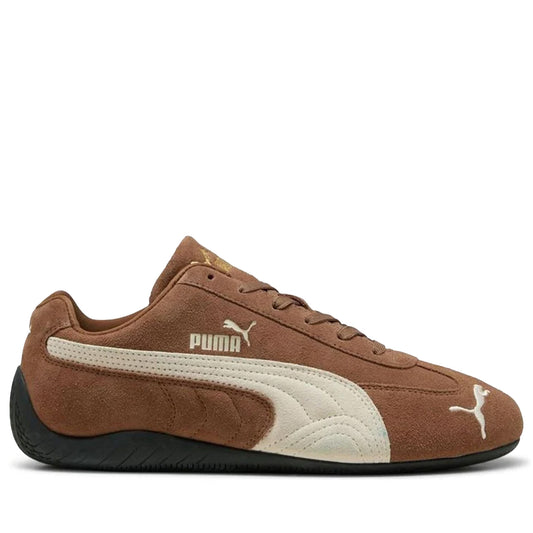 Brown Puma sneaker with white logo on a white background