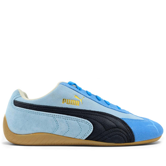 Blue and black Puma sneaker on a white background