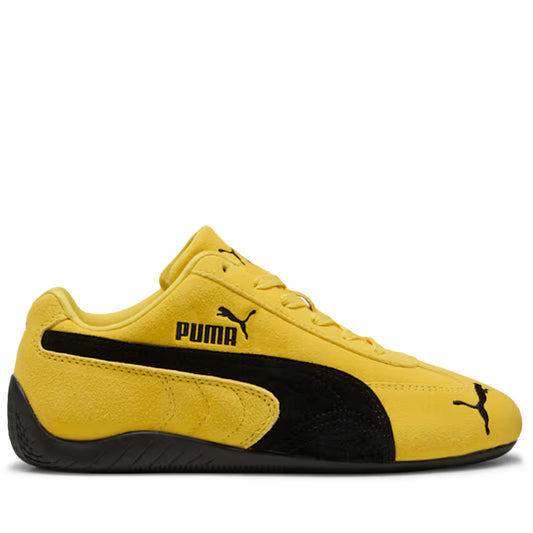 Yellow and black Puma sneaker on a white background